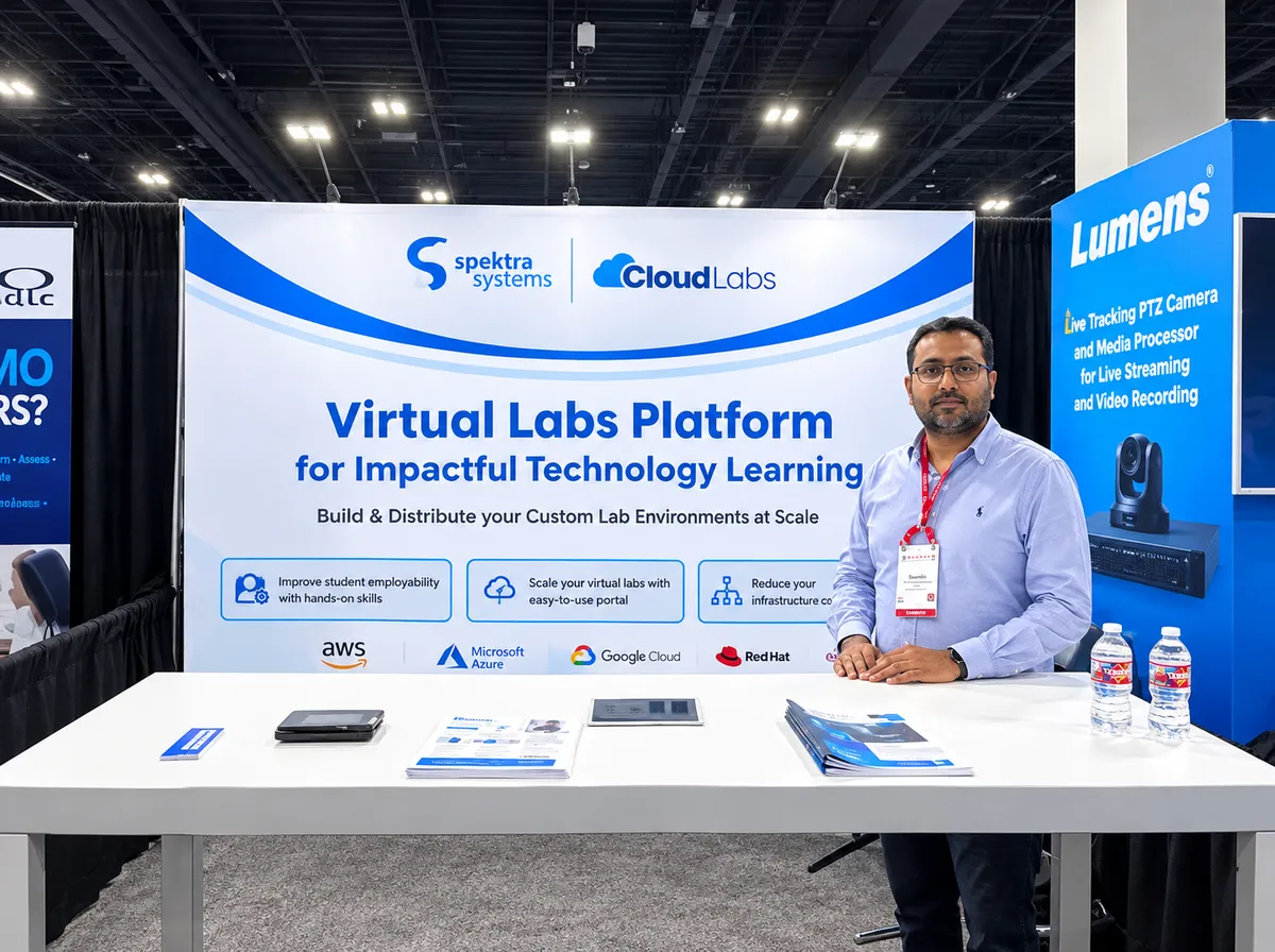 A CloudLabs team member at the Spektra Systems stand, in front of a Virtual Labs Platform for Impactful Technology Learning banner